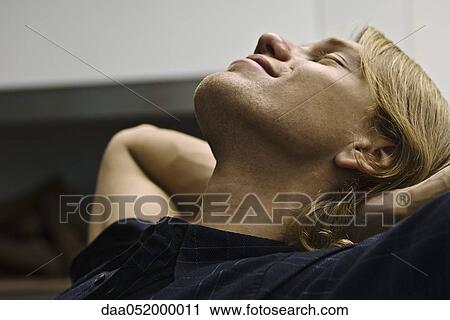 Stock Image - Man daydreaming. Fotosearch