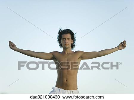 Man doing yoga pose outdoors View Large Photo Image Stock Image - Man doing yoga pose outdoors. Fotosearch