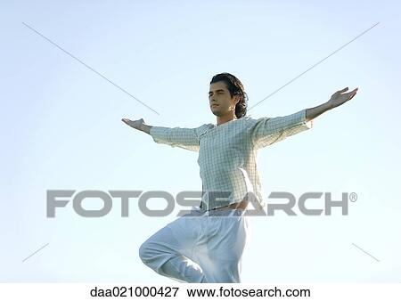 Man doing yoga pose View Large Photo Image Stock Photo - Man doing yoga pose. Fotosearch