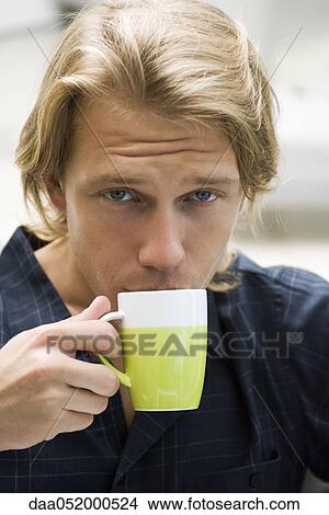 Picture - Man drinking coffee. Fotosearch