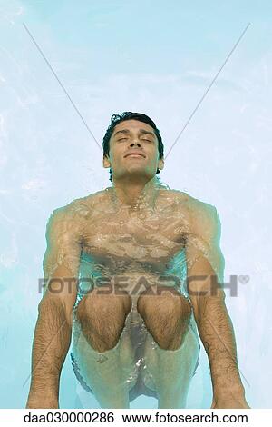 Man holding on to edge of swimming pool, head back, eyes closed View Large Photo Image Stock Photograph - Man holding on to edge of swimming pool, head back, eyes closed. Fotosearch