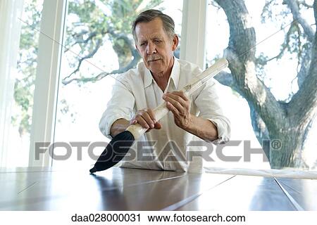 Man holding oversized calligraphy brush View Large Photo Image Stock Image - Man holding oversized calligraphy brush. Fotosearch