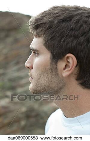 Stock Photo - Man in nature, portrait. Fotosearch