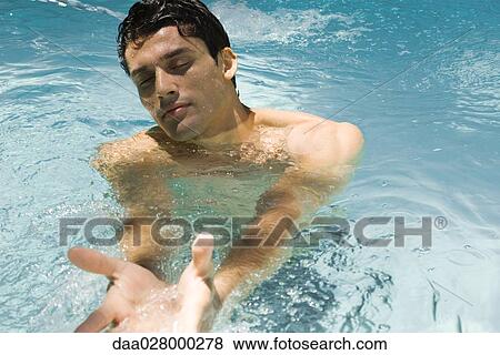 Man in swimming pool, eyes closed, arms outstretched View Large Photo Image Stock Photo - Man in swimming pool, eyes closed, arms outstretched. Fotosearch