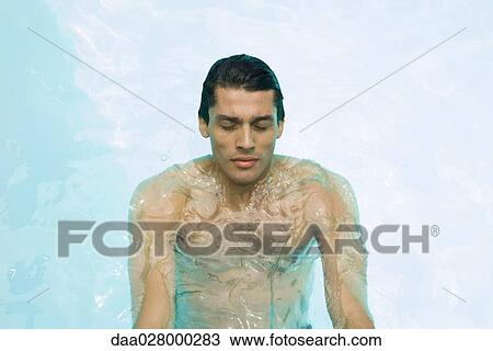 Man in swimming pool, eyes closed, high angle view View Large Photo Image Stock Image - Man in swimming pool, eyes closed, high angle view. Fotosearch
