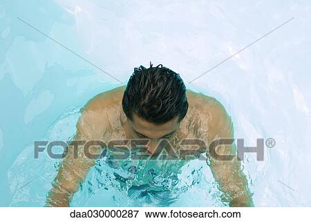 Man in swimming pool, high angle view View Large Photo Image Stock Photo - Man in swimming pool, high angle view. Fotosearch
