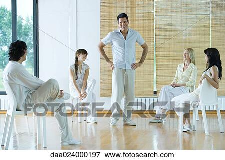 Man leading group therapy session View Large Photo Image Stock Photo - Man leading group therapy session. Fotosearch
