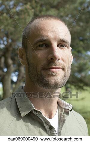 Man outdoors, portrait View Large Photo Image Stock Image - Man outdoors, portrait. Fotosearch