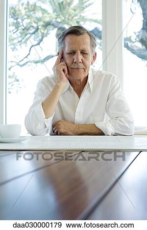 Man studying blueprint View Large Photo Image Stock Photo - Man studying blueprint. Fotosearch