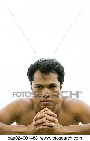 Stock Photo - Man with hands clasped. Fotosearch