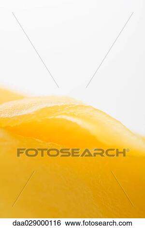 Stock Photograph - Mango fruit flesh, extreme close-up. Fotosearch
