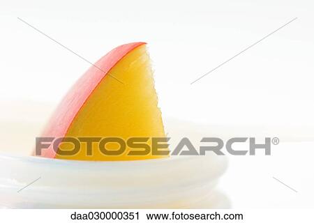 Mango slice in small jar, close-up View Large Photo Image Stock Image - Mango slice in small jar, close-up. Fotosearch