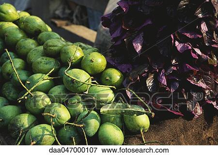 Mangoes being sold at farmer's market, India View Large Photo Image Stock Photo - Mangoes being sold at farmer's market, India. Fotosearch