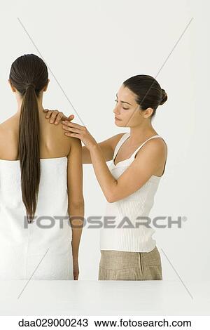 Massage therapist giving woman a shoulder massage View Large Photo Image Stock Image - Massage therapist giving woman a shoulder massage. Fotosearch
