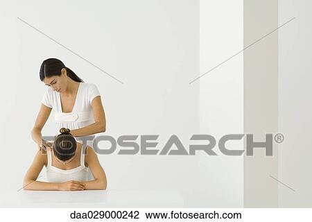 Massage therapist massaging woman's back View Large Photo Image Stock Image - Massage therapist massaging woman's back. Fotosearch
