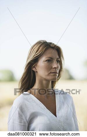 Mid-adult woman, portrait View Large Photo Image Stock Image - Mid-adult woman, portrait. Fotosearch