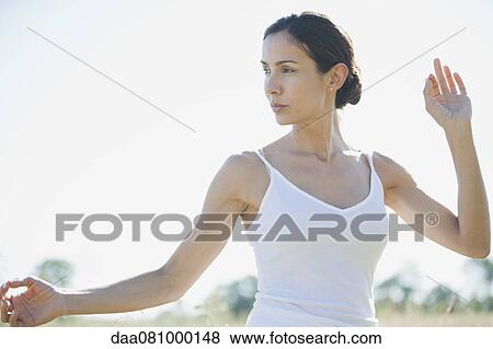 Mid-adult woman practicing yoga View Large Photo Image Stock Photo - Mid-adult woman practicing yoga. Fotosearch