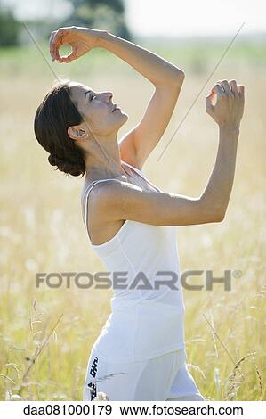 Mid-adult woman practicing yoga View Large Photo Image Stock Photo - Mid-adult woman practicing yoga. Fotosearch