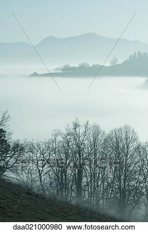 Stock Image - Misty mountain landscape. Fotosearch