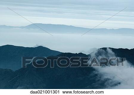 Stock Image - Misty mountainscape. Fotosearch