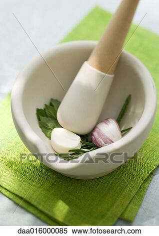 Mortar and pestle with herbs and garlic View Large Photo Image Stock Photography - Mortar and pestle with herbs and garlic. Fotosearch