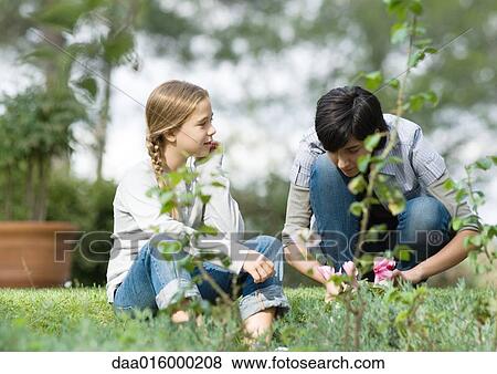 Mother and daughter doing yard work View Large Photo Image Stock Photo - Mother and daughter doing yard work. Fotosearch