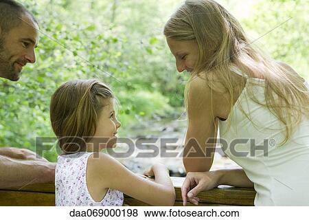 Stock Photo - Mother and daughter spending time together outdoors. Fotosearch
