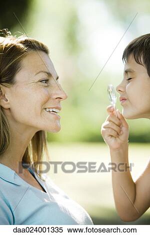 Mother and son, boy looking through magnifying glass, side view, close-up View Large Photo Image Stock Photography - Mother and son, boy looking through magnifying glass, side view, close-up. Fotosearch