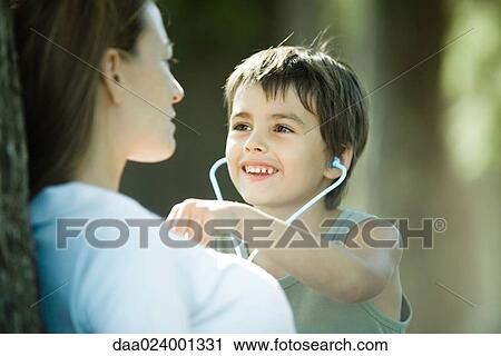 Mother and son, boy pretending to be doctor View Large Photo Image Stock Image - Mother and son, boy pretending to be doctor. Fotosearch