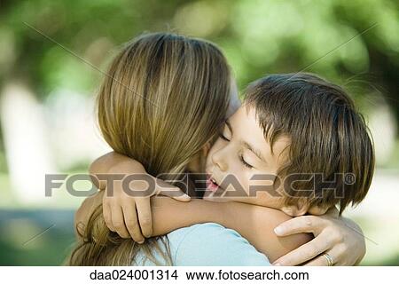 Picture - Mother and son hugging, close-up. Fotosearch