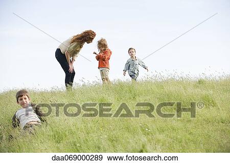 Mother consoling daughter outdoors View Large Photo Image Stock Photo - Mother consoling daughter outdoors. Fotosearch
