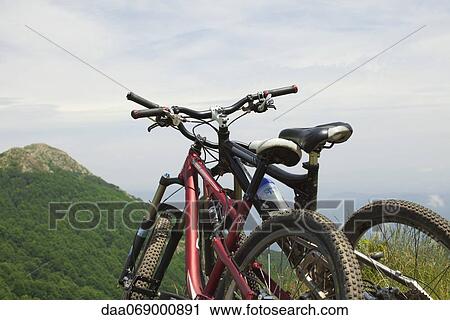 Mountain bikes against view of mountain View Large Photo Image Stock Image - Mountain bikes against view of mountain. Fotosearch