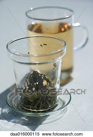 Mug of tea and tea strainer View Large Photo Image Stock Photography - Mug of tea and tea strainer. Fotosearch