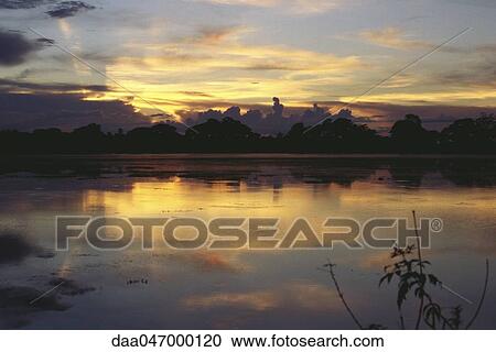 Stock Image - Myanmar (Burma), waterscape at sunset. Fotosearch