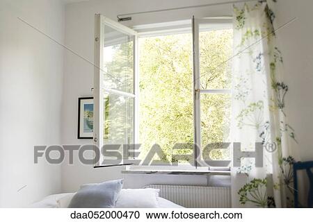 Stock Image - Open window in bedroom. Fotosearch