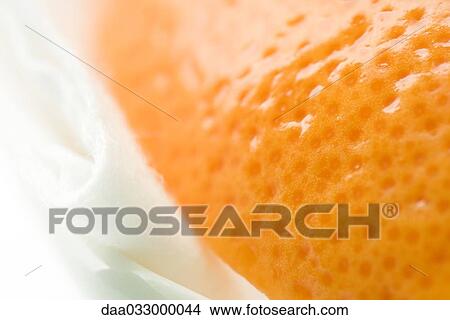 Orange and cosmetic pad, extreme close-up View Large Photo Image Picture - Orange and cosmetic pad, extreme close-up. Fotosearch