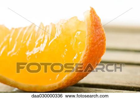 Orange slice, close-up View Large Photo Image Stock Photograph - Orange slice, close-up. Fotosearch