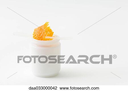 Orange zest in small jar, tiny plastic spatula jutting out View Large Photo Image Stock Image - Orange zest in small jar, tiny plastic spatula jutting out. Fotosearch