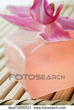 Stock Image - Orchid flower and bar of soap. Fotosearch