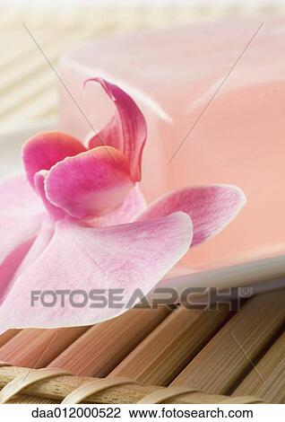 Stock Image - Orchid flower and bar of soap. Fotosearch