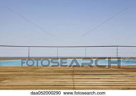 Outdoor swimming pool with wooden deck View Large Photo Image Stock Image - Outdoor swimming pool with wooden deck. Fotosearch