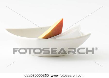 Pear slice and napkin in dish View Large Photo Image Stock Image - Pear slice and napkin in dish. Fotosearch