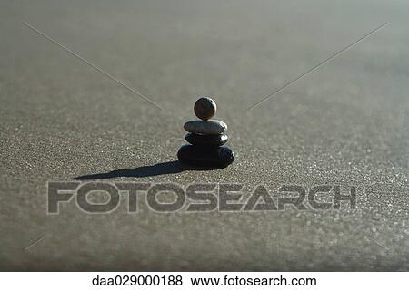 Pebbles stacked at the beach View Large Photo Image Stock Photo - Pebbles stacked at the beach. Fotosearch