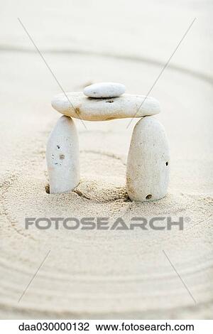 Pebbles stacked in arch formation View Large Photo Image Stock Image - Pebbles stacked in arch formation. Fotosearch