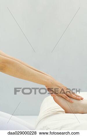 Person receiving foot massage, close-up, cropped view View Large Photo Image Stock Photo - Person receiving foot massage, close-up, cropped view. Fotosearch