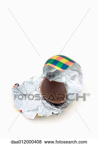 Piece of chocolate egg on wrapper View Large Photo Image Stock Photo - Piece of chocolate egg on wrapper. Fotosearch
