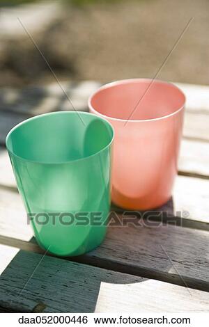 Stock Photograph - Plastic cups on table. Fotosearch
