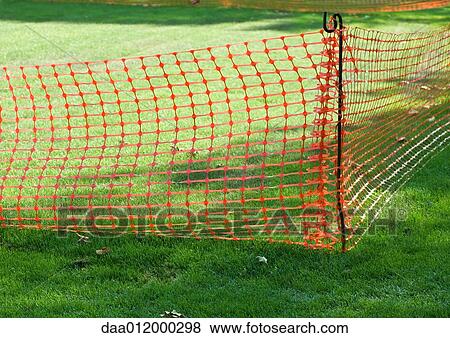 Plastic mesh fence on grass View Large Photo Image Stock Photo - Plastic mesh fence on grass. Fotosearch