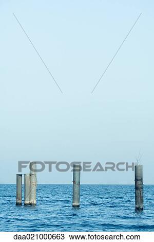 Posts emerging from water View Large Photo Image Stock Image - Posts emerging from water. Fotosearch