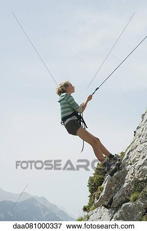 Preteen girl rock climbing View Large Photo Image Stock Photo - Preteen girl rock climbing. Fotosearch